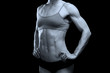 Muscular female body against black background