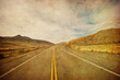 grunge image of highway and blue sky