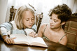 Photo: Portraits of young childs reading a book Portraits of young childs reading a book