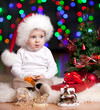funny baby in Santa Claus hat on bright festive background