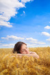 Foto : Pretty woman on yellow wheat field Pretty woman on yellow wheat field