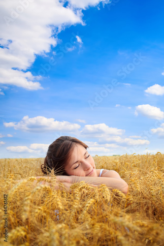 Photo: Pretty woman on yellow wheat field Pretty woman on yellow wheat field