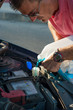 Photo: Filling in fluid Filling in fluid