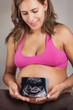 Pregnant Woman Holding Ultrasound