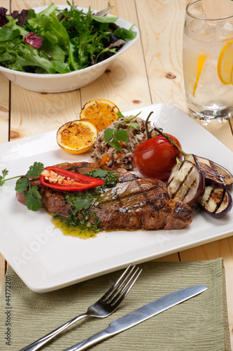 Photo: Piece of Medium Rare Steak with Spicy Herb Sauce Piece of Medium Rare Steak with Spicy Herb Sauce