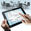 Hands holding tablet