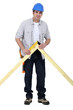 Carpenter checking wooden joint