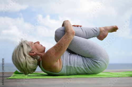 Photo: Woman practicing yoga Woman practicing yoga