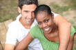 Photo: Interracial couple in a park Interracial couple in a park