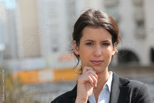 Photo: Businesswoman outside office Businesswoman outside office