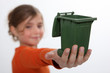 Photo: Girl holding recycling bin Girl holding recycling bin