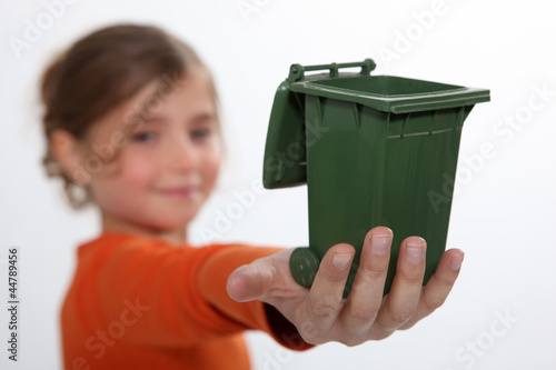 Photo: Girl holding recycling bin Girl holding recycling bin