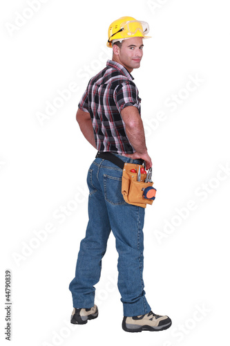 Photo: Portrait of a tradesman looking over his shoulder Portrait of a tradesman looking over his shoulder