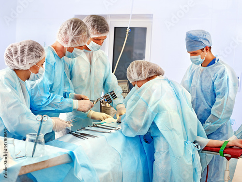 Photo: Surgeon at work in operating room. Surgeon at work in operating room.