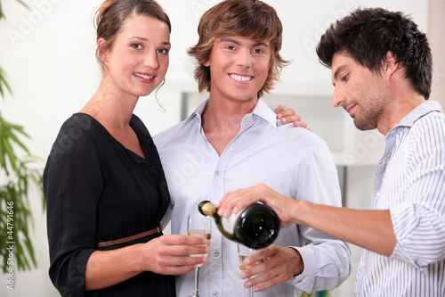 Photo: Friends with champagne glasses Friends with champagne glasses
