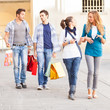 Happy Girls With Bored Boys on Shopping