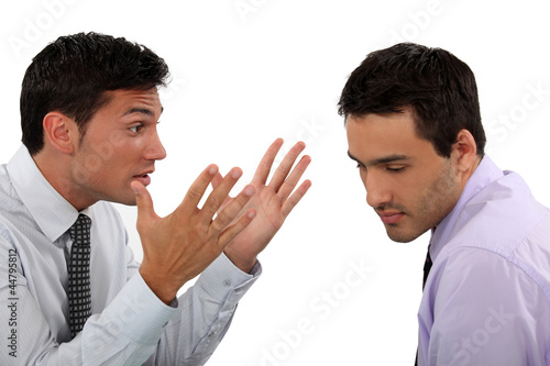 Photo: Two young businessmen having an argument Two young businessmen having an argument