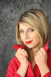 Seductive blond wearing red lip-stick