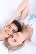 Foto: Couple lying with their heads side by side Couple lying with their heads side by side