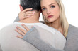 Woman comforting husband