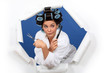 Funny girl with hair curlers, scissors and a comb