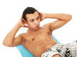 Athletic young man doing abs training