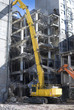 Hydraulic hammer demolishing old buildings