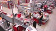 Crane shot of cash desk at a supermarket.