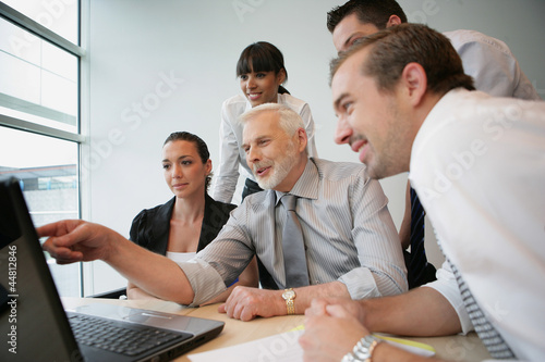 Photo: Salesteam in front of computer Salesteam in front of computer