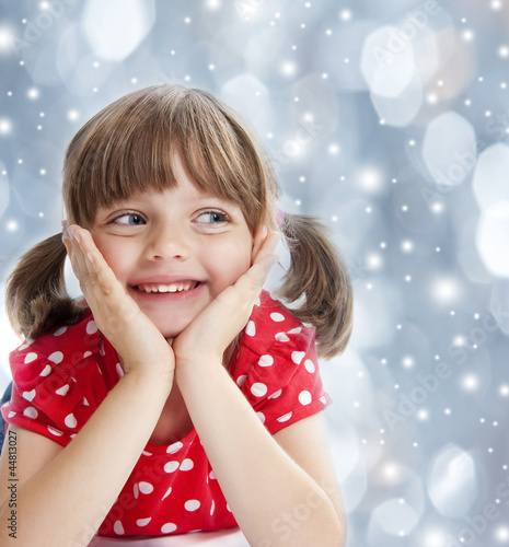 Foto: happy little girl at the christmastime happy little girl at the christmastime