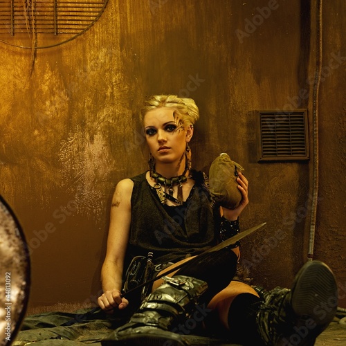 Photo: Tired woman with a spear in a bunker Tired woman with a spear in a bunker