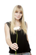 Foto: young beautiful blond haired girl gives you a flower young beautiful blond haired girl gives you a flower
