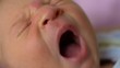 11 days old newborn yawning baby face