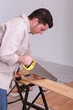 portrait of a man sawing
