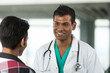 Photo: Indian Doctor talking a patient. Indian Doctor talking a patient.