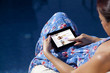 Young girl holding and touching a digital tablet