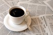 Photo: coffee over newspaper coffee over newspaper