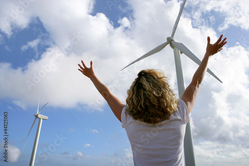 Photo: Woman in front of wind turbines Woman in front of wind turbines