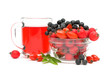 cup of tea with rose hips and different berries close up