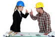 Engineer having an argument with a tradesman