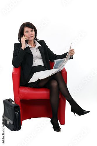 Photo: Businesswoman talking on her mobile phone Businesswoman talking on her mobile phone