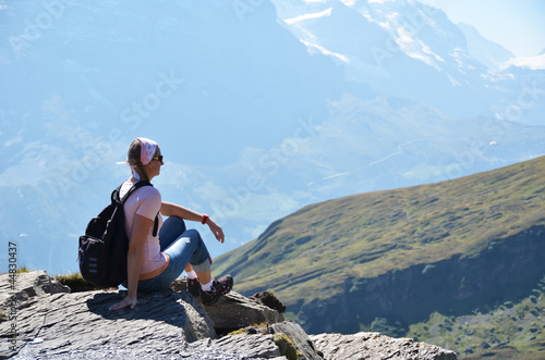 Photo: Traveler on the top of a mountain. Switzerland Traveler on the top of a mountain. Switzerland