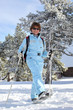 Woman walking through the snow with special shoes