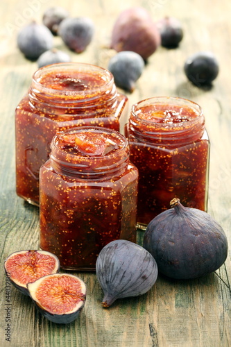 Photo: Figs and homemade jam in glass jars. Figs and homemade jam in glass jars.