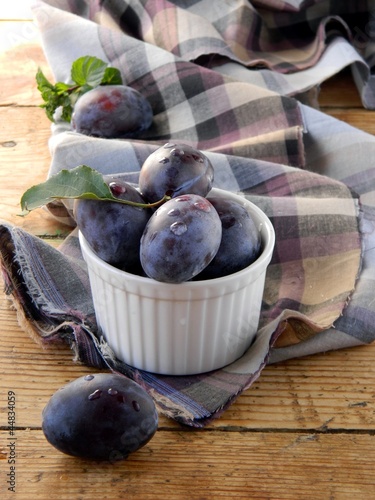 Photo: Fresh plums in a bowl Fresh plums in a bowl