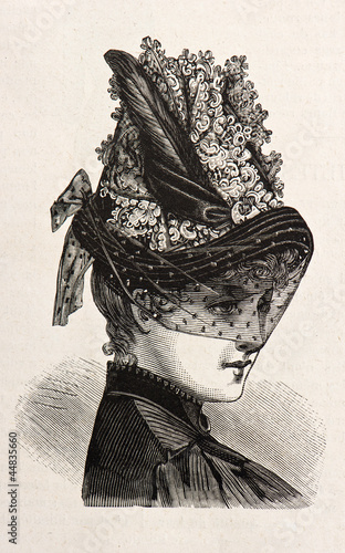 Photo: young woman wearing an elegant hat. engraved illustration 1885 young woman wearing an elegant hat. engraved illustration 1885