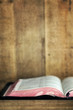 Photo: Old Bible Open on Bookshelf with Grunge Effects Old Bible Open on Bookshelf with Grunge Effects