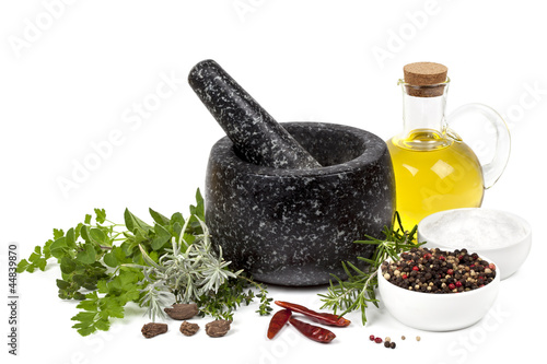 Photo: Mortar and Pestle with Herbs and Spices Isolated Mortar and Pestle with Herbs and Spices Isolated