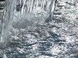 Close up of water splashing into swimming pool