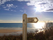 Sign post for coast path near beach, Gerrans Bay, Cornwall, United Kingdom